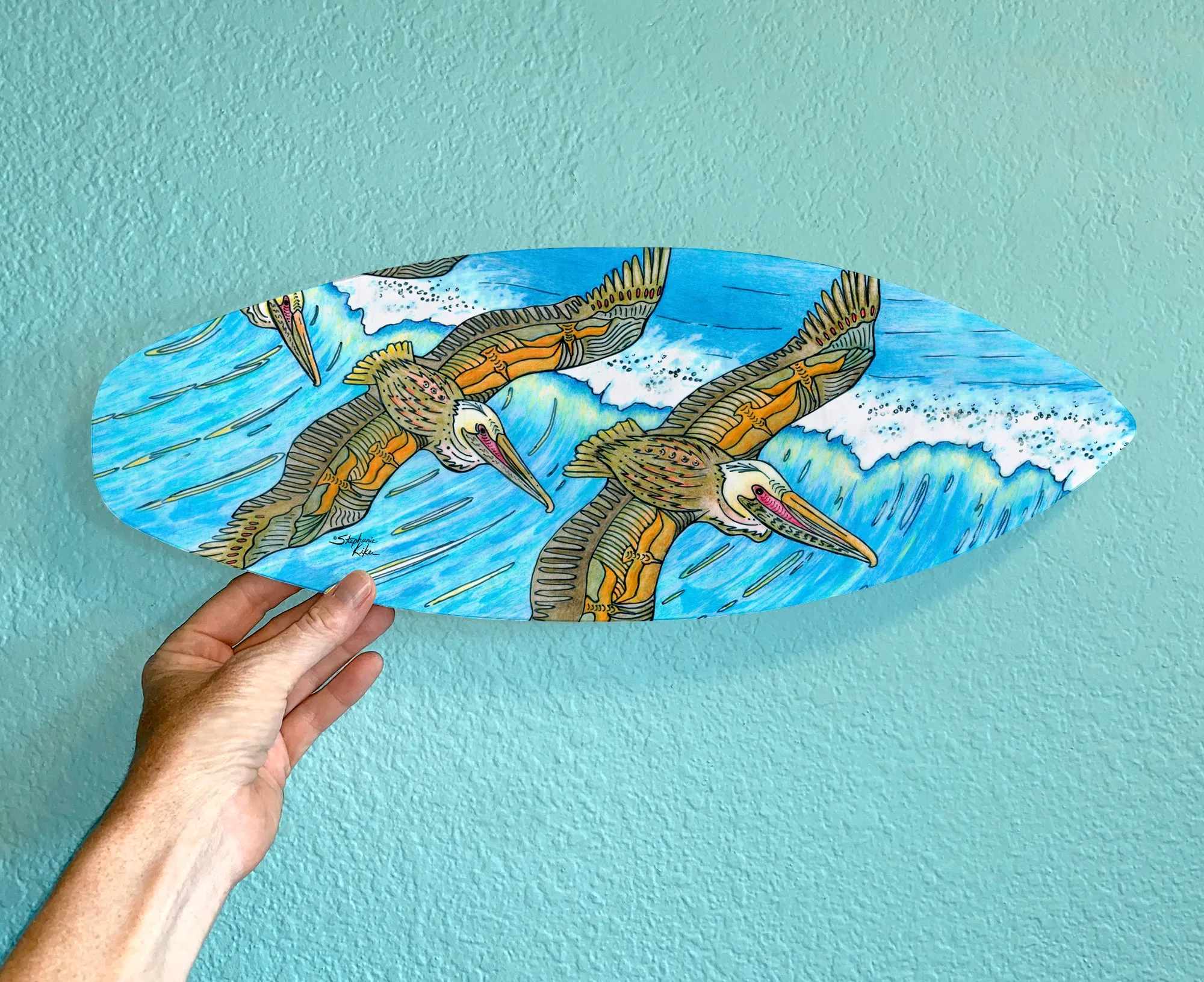 Surfboard Wall Art with Wings Flying over Waves